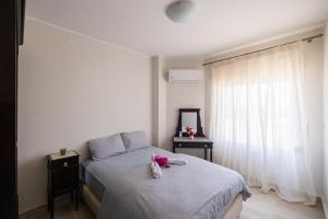 a bedroom with a bed with a dresser and a window at 4BRs Beachside with Penthouse and stunning Seaview l EINBAY in Ain Sokhna