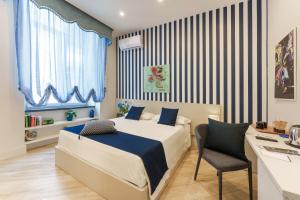 A bed or beds in a room at It's Room Naples