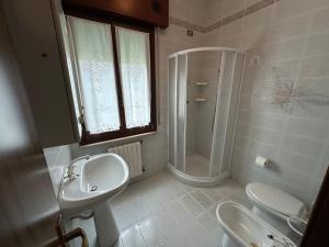 Koupelna v ubytování Ca' Bosega - Agenzia Cocal + 7 fotografií
