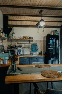 a kitchen with a wooden table with two baskets on it at Карпатське Hygge in Slavske