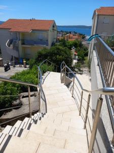 a stairway leading up to a balcony with a view at Orchid in Selce