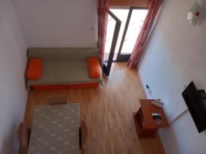 an overhead view of a living room with a couch at Orchid in Selce +10 photos