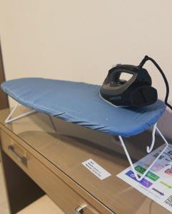 a drone sitting on top of a bed at Skoulidis Family Apartments in Nea Vrasna