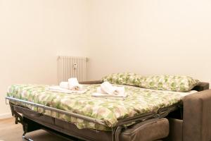 Ένα ή περισσότερα κρεβάτια σε δωμάτιο στο Ca' Martha - A due passi dal centro con parcheggio privato