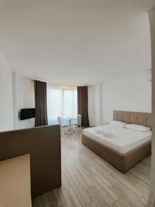 Postel nebo postele na pokoji v ubytování Hotel Restaurant Univers
