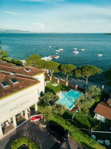 an aerial view of a building and the ocean at Hotel Ristorante Sogno in San Felice del Benaco