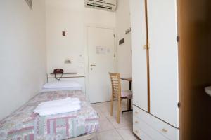 Postel nebo postele na pokoji v ubytování Hotel Odeon
