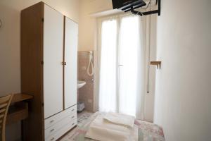Postel nebo postele na pokoji v ubytování Hotel Odeon
