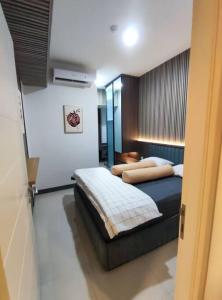 a bedroom with a bed in a room at Apartment Benson Tower 2 Bed Room by Lavida in Surabaya
