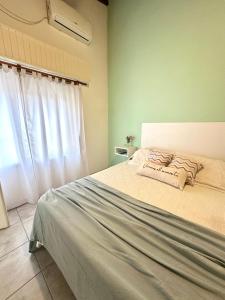 Ένα ή περισσότερα κρεβάτια σε δωμάτιο στο Sicilia