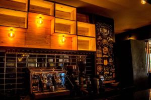 a room with a bar with a machine on the wall at HAMILTON Agadir in Agadir