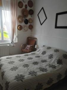 Ένα ή περισσότερα κρεβάτια σε δωμάτιο στο Appartement GUISE Familistere