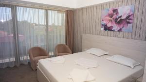 Postel nebo postele na pokoji v ubytování Hotel Alis