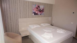 Postel nebo postele na pokoji v ubytování Hotel Alis