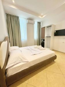 Postel nebo postele na pokoji v ubytování Hotel Balili