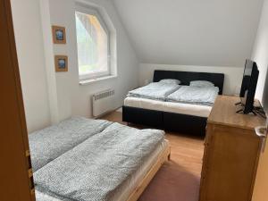 Postel nebo postele na pokoji v ubytování SKI&Fun Donovaly Magura