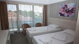 Postel nebo postele na pokoji v ubytování Hotel Alis