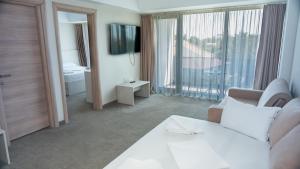 Postel nebo postele na pokoji v ubytování Hotel Alis