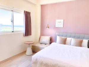 Een bed of bedden in een kamer bij 沙沙民宿