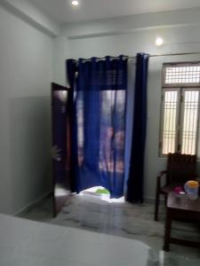 Voodi või voodid majutusasutuse Raghubir Nikunj Homestay toas