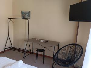 TV a/nebo společenská místnost v ubytování Hostal Pensión Mar de Plata + 24 fotografií
