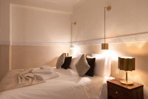 Postel nebo postele na pokoji v ubytování Riad N'S & Spa