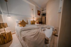 Postel nebo postele na pokoji v ubytování Riad N'S & Spa
