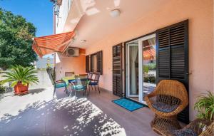a patio with chairs and a table on a patio at Nice Apartment In Valbandon With Wifi in Valbandon