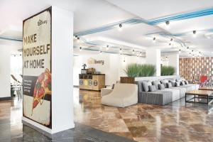 a lobby with a couch and a table at tent Playa de Palma in Playa de Palma