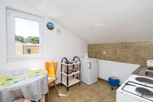 Kuchyň nebo kuchyňský kout v ubytování Apartments Marija