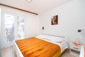 Postel nebo postele na pokoji v ubytování Apartments Marija