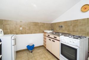 Kuchyň nebo kuchyňský kout v ubytování Apartments Marija