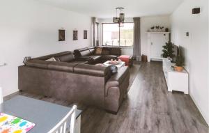 a living room with a couch and a table at Pet Friendly Home In Zeewolde With Wifi in Zeewolde