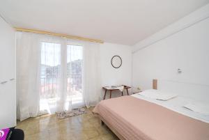 Postel nebo postele na pokoji v ubytování Apartments Marija