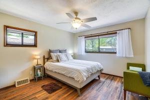 a bedroom with a bed and a ceiling fan at Quiet Home with Garden about 7 Mi to Patagonia Lake! in Patagonia