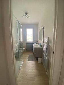 a bathroom with a shower and a sink and a tub at Casa dall'Angelo in Valmaggiore +10 photos