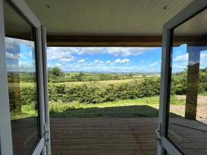 a view from the front door of a house at Castle Glen Lodge in Dumfries +26 photos