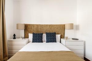 Postel nebo postele na pokoji v ubytování Fabiana