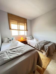 Postel nebo postele na pokoji v ubytování Casa Sant Antoni