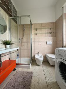 a bathroom with a shower and a toilet and a sink at Charm in centre, sunset, movida! in Milano Marittima +32 photos