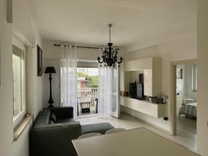 a living room with a couch and a table at Charm in centre, sunset, movida! in Milano Marittima