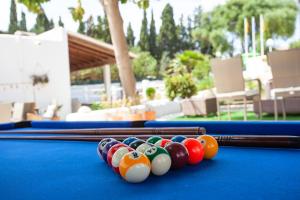 a group of billiard balls on a pool table at BJ Apartamentos Europa in Sa Coma