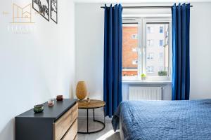 Postel nebo postele na pokoji v ubytování Premium Apartment Mechaniczna 5W