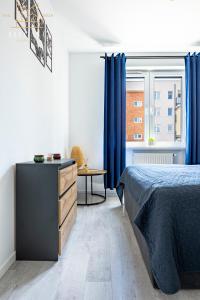Postel nebo postele na pokoji v ubytování Premium Apartment Mechaniczna 5W