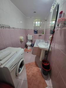 a bathroom with a washing machine and a sink at Black Sea in Constanţa +27 photos