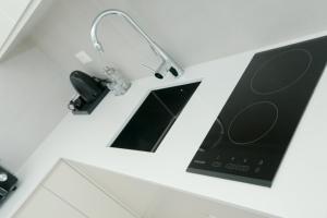 Kuchyň nebo kuchyňský kout v ubytování NÓS Luxury Rooms Shkoder
