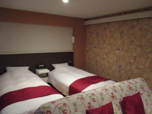 Postel nebo postele na pokoji v ubytování Town Hotel 41