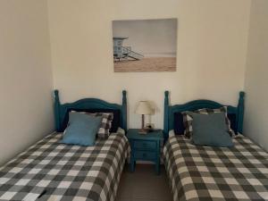 Posteľ alebo postele v izbe v ubytovaní Beach Front Villa VV