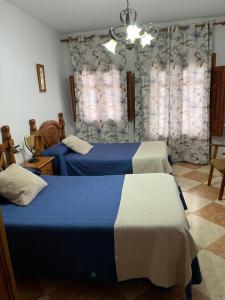 Postel nebo postele na pokoji v ubytování Hostal Moraima