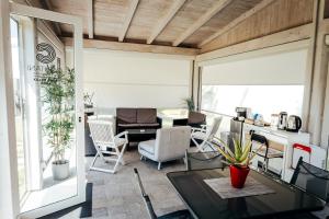 a living room with a table and chairs at Capitani Guest House in Fiumicino